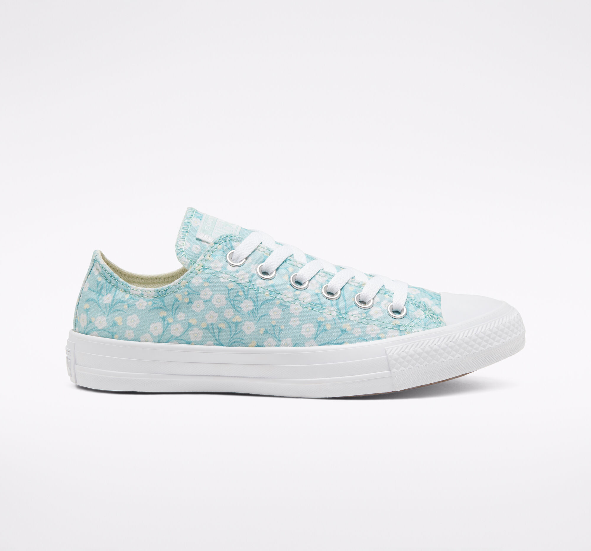 white converse with flowers