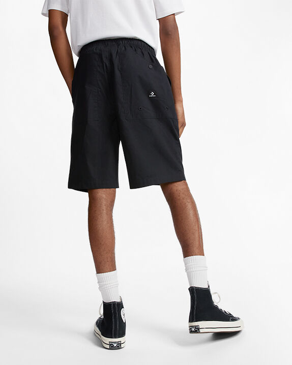 black high top converse with shorts