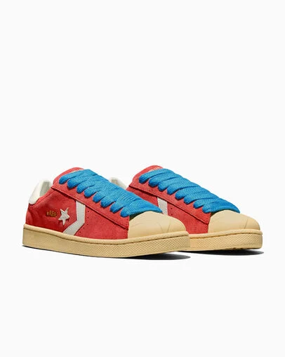 Converse x GOLF le FLEUR* Pro Leather Molten Lava/Banana Crepe/Blue, Top and Side View
