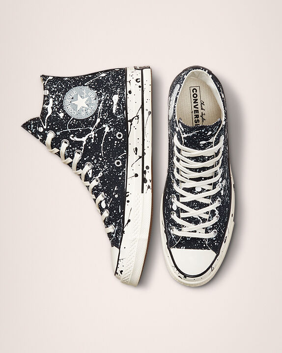 white converse with paint splatter