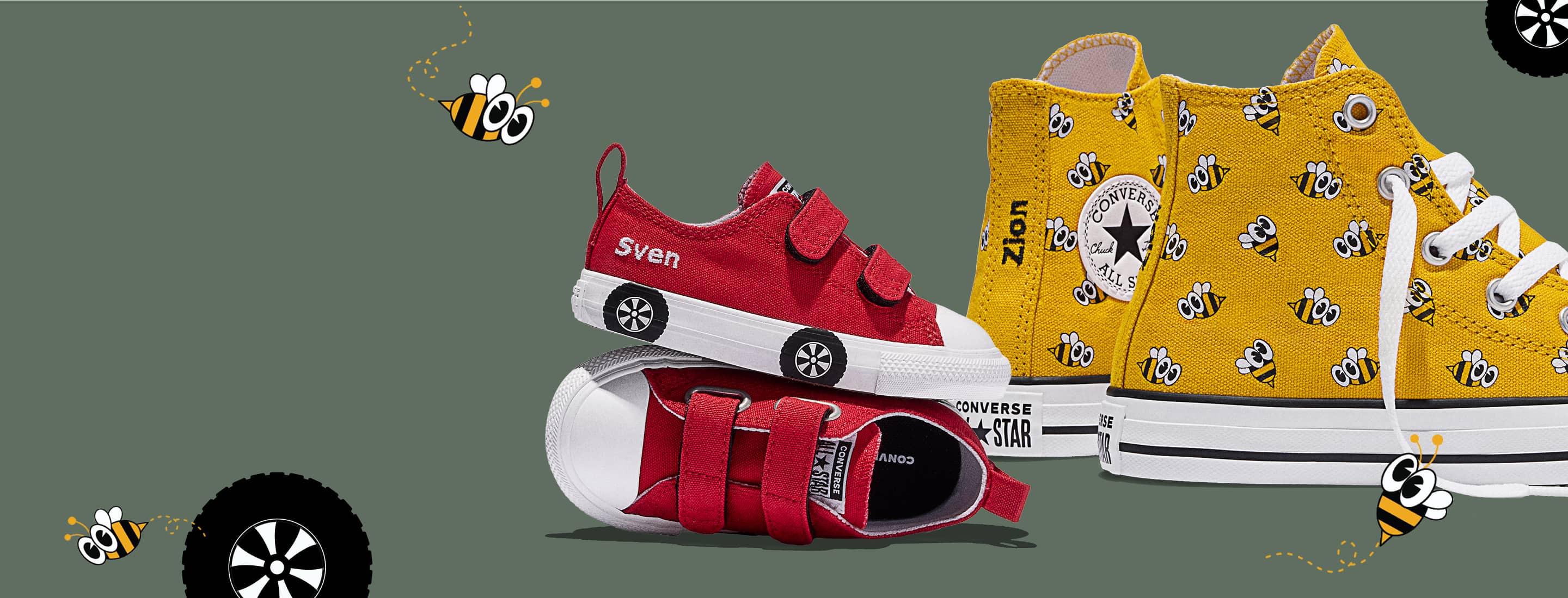 This is a stylized product image showing kids&rsquo; Converse sneakers on a muted green background with playful bee and wheel graphics.