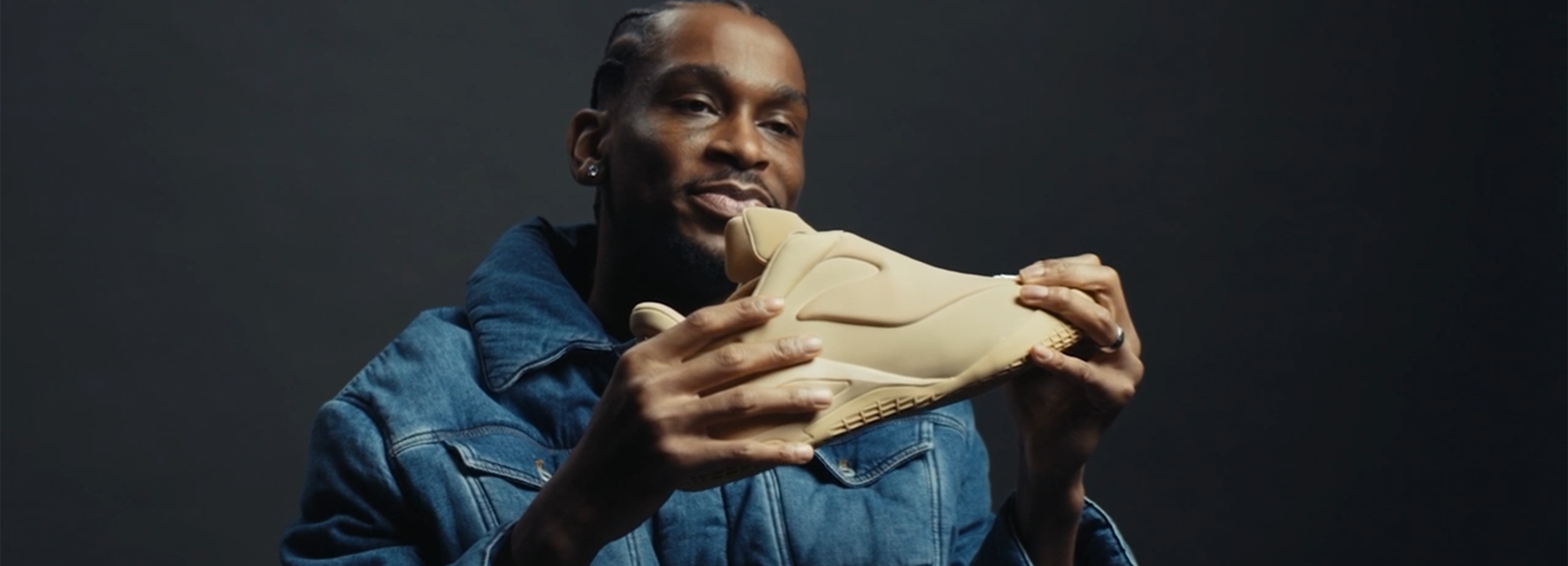 Shai Gilgeous Alexander holding the SHAI 001 shoe