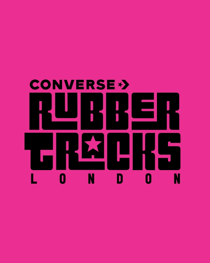 The image features bold black text on a bright pink background that reads &ldquo;CONVERSE RUBBER TRACKS LONDON&rdquo; with stylized letters and star symbols. It appears to be a logo or promotional graphic for Converse Rubber Tracks in London.