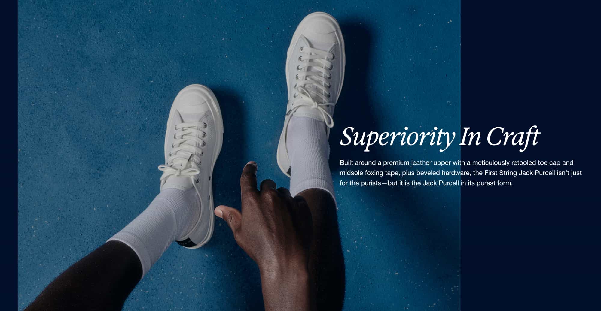 Overhead image of white low top Jack Purcell shoes
