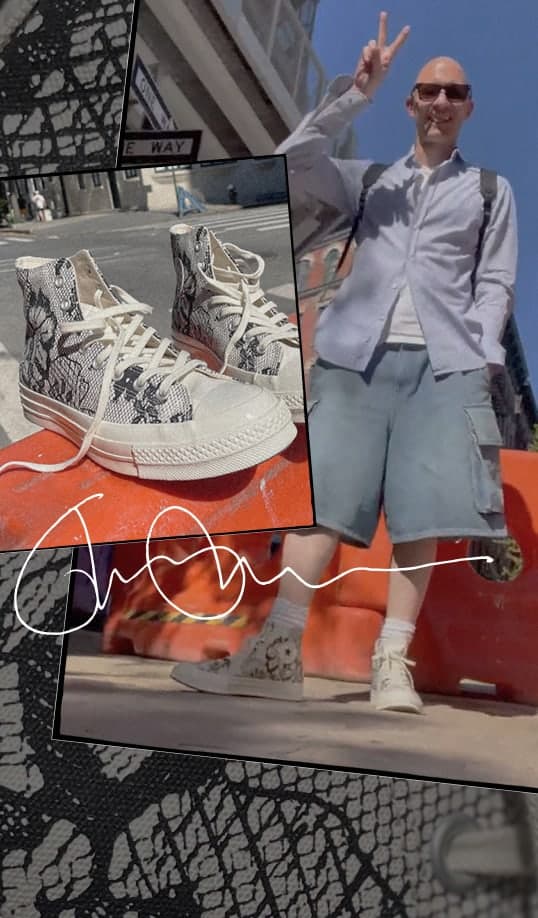 This image is a collage featuring a person and a pair of high-top sneakers with a snakeskin pattern. The main part of the collage shows a person standing outdoors on a sunny day, wearing light blue cargo shorts, white socks, and the same snakeskin-patterned high-top sneakers. The person is making a peace sign with their right hand and has their face blurred for privacy. They are also wearing a light-colored button-up shirt over what appears to be a white t-shirt and carrying a backpack.