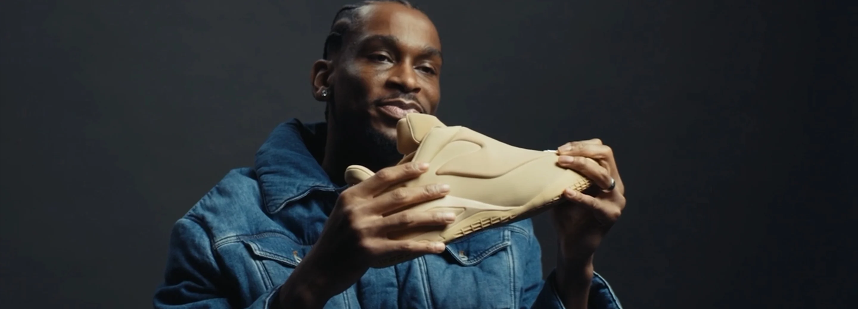 Shai Gilgeous Alexander holding the SHAI 001 shoe